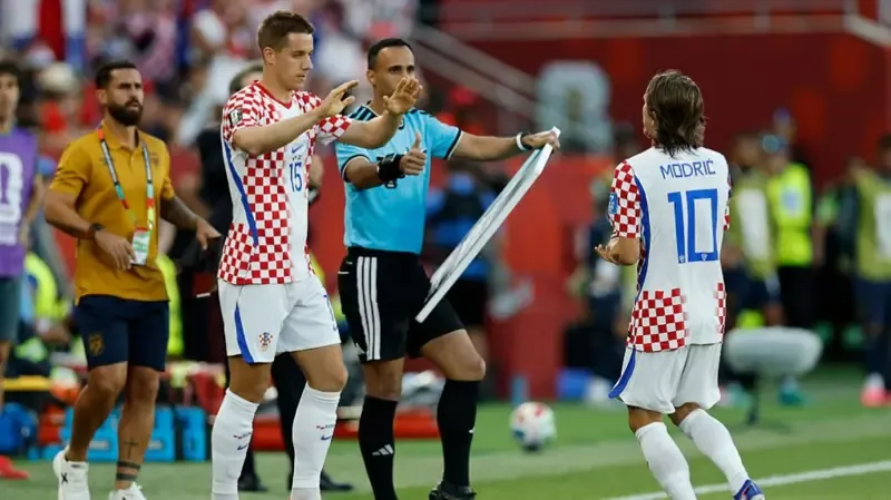 Luka Modric of Croatia high fives Mario Pasalic #15 as he is substituted during the FIFA World Cup 2026 Group L match between Panama and Croatia at Toronto Stadium.