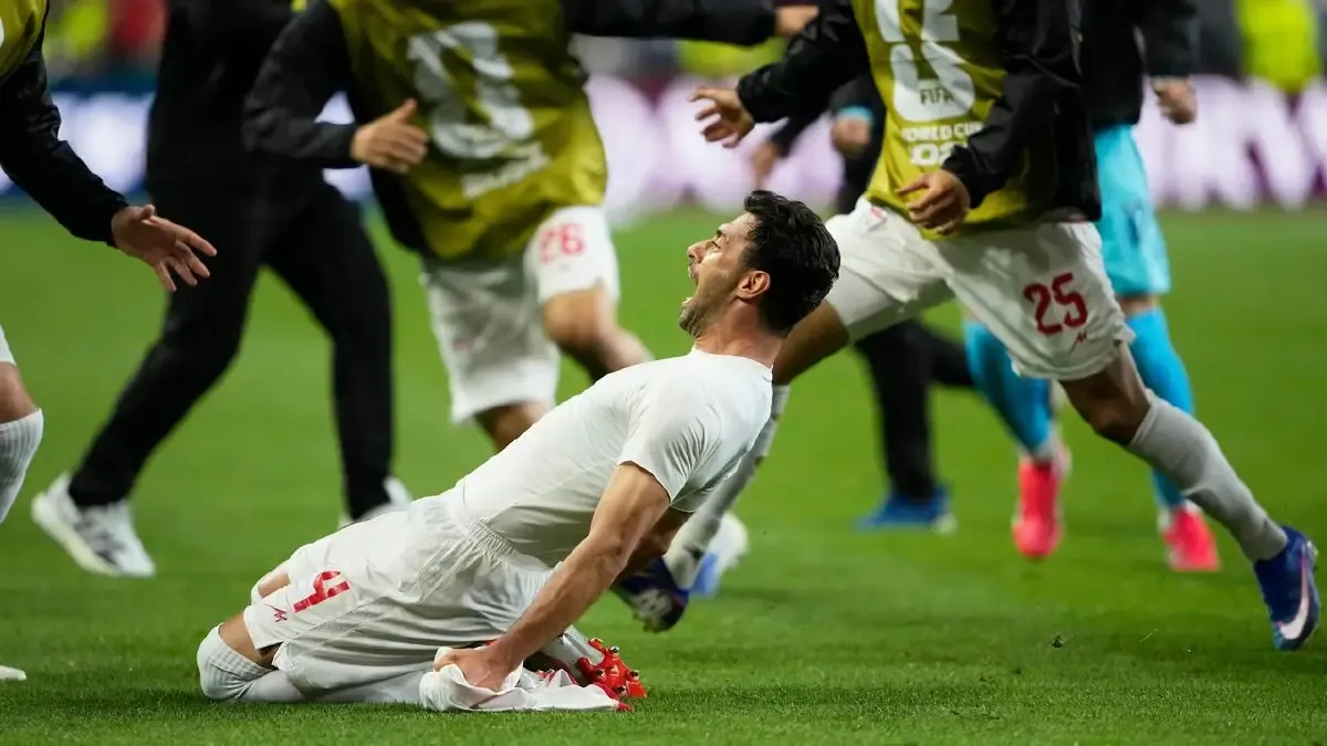 Iran's Shoja Khalilzadeh scored in stoppage time, but it was overturned after a VAR review. (AP PHOTO)