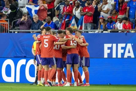Scotland players celebrate their goal during the first half