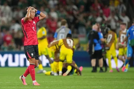 South Korea’s Son Heung-min reacts at full time as South Africa celebrate.