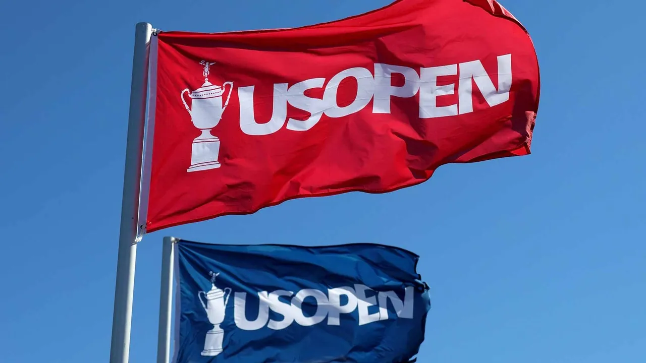2026 U.S. Open flags flapping in wind at Shinnecock Hills Golf Club.