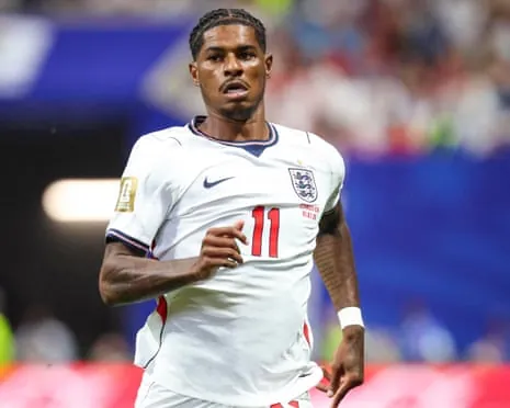 Marcus Rashford in a white England shirt runs during the World Cup match with the Democratic Republic of the Congo