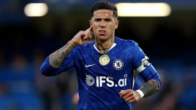Enzo Fernandez sticks a finger into his ear in celebration