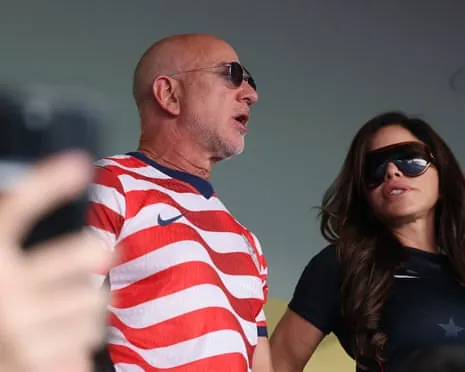 Jeff Bezos and Lauren Sánchez watching the USA USA USA go out of the GWC