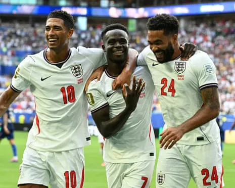 Bukayo Saka (centre) celebrates with Jude Bellingham and Reece James after scoring his third goal and England’s fifth.