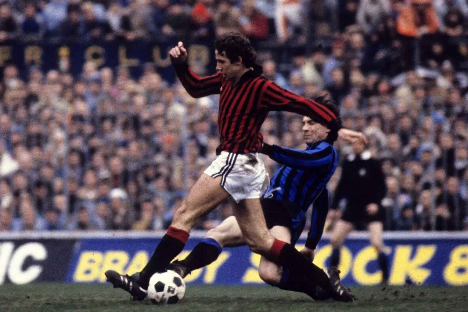 AC Milan's Franco Baresi holds off the challenge of Inter's Gianpiero Marini in 1979