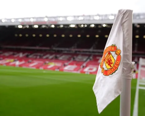 A corner flag slumps on its pole at Old Trafford