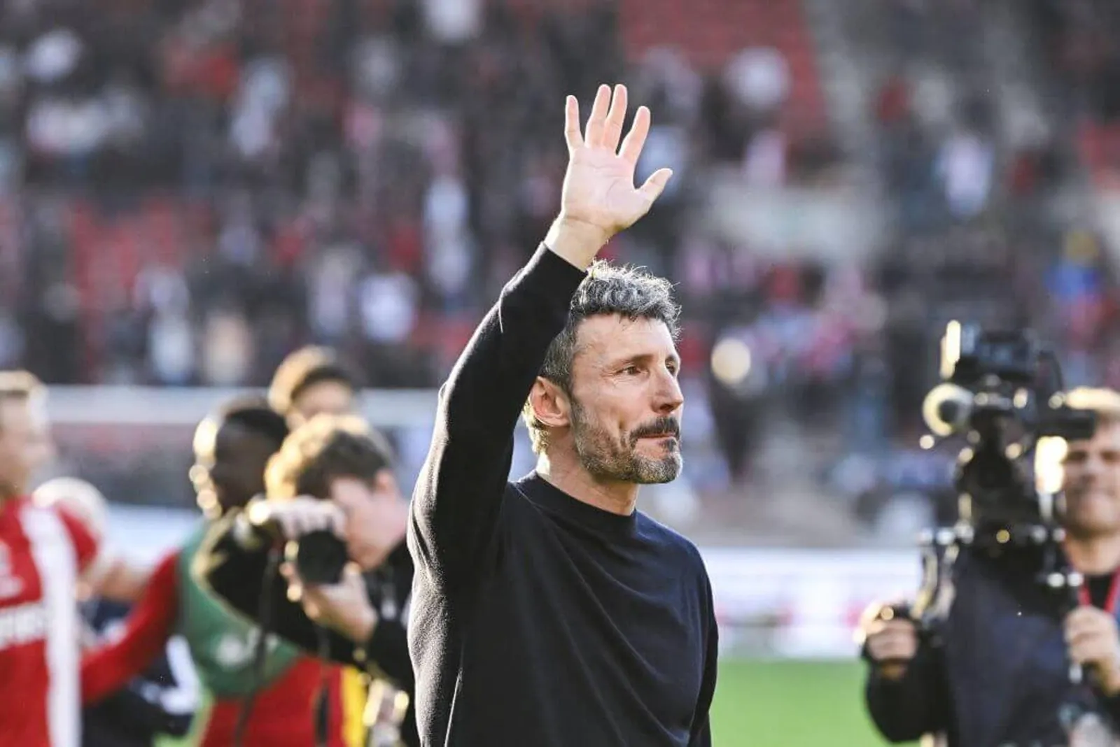 Van Bommel waving to the crowd