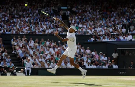 Nick Kyrgios smashes against Novak Djokovic in the Wimbledon men’s singles final in 2022