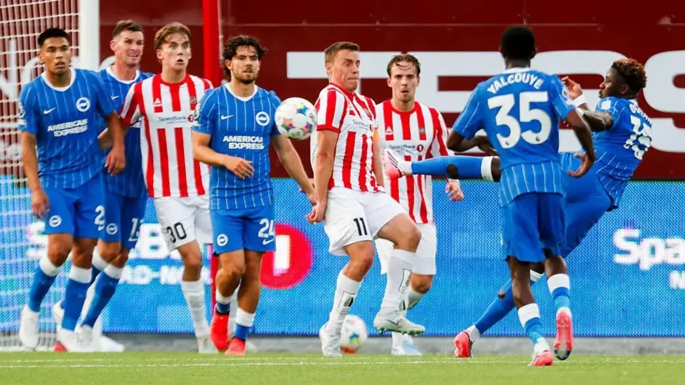 Brighton's Ibrahim Osman shooting at a wall of defenders