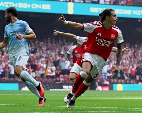 Riccardo Calafiori of Arsenal celebrates scoring his team's first goal.