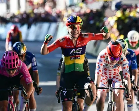 Kim Le Court celebrates as she crosses the finish line to win stage six of the Tour de France Femmes