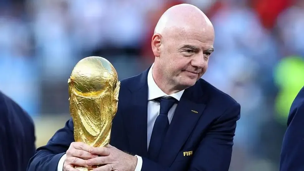 Infantino holding the World Cup