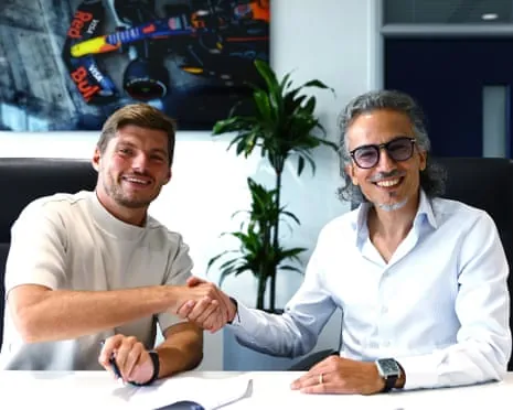 Max Verstappen and Red Bull team principal Laurent Mekies shake hands