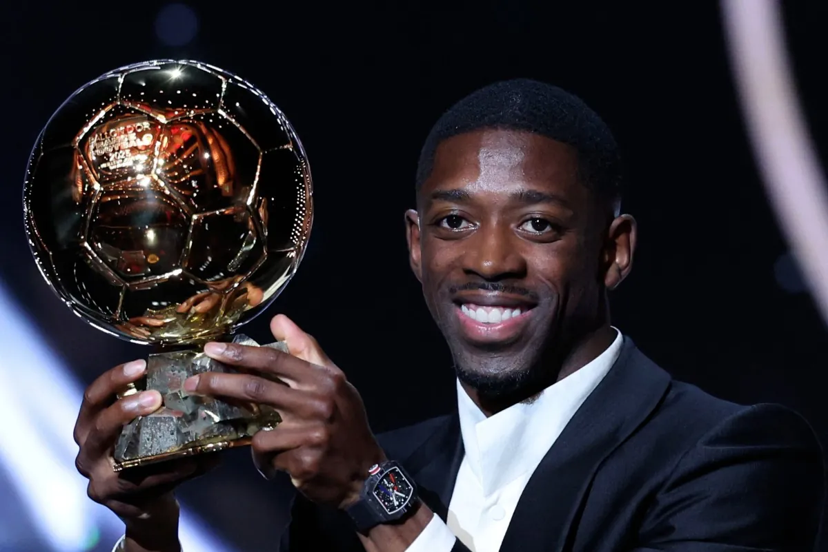 Paris Saint-Germain’s French forward Ousmane Dembele reacts receiving the Ballon d’Or award during the 2025 Ballon d’Or France Football award ceremony at the Theatre du Chatelet in Paris on September 22, 2025. (Photo by Franck FIFE / AFP)