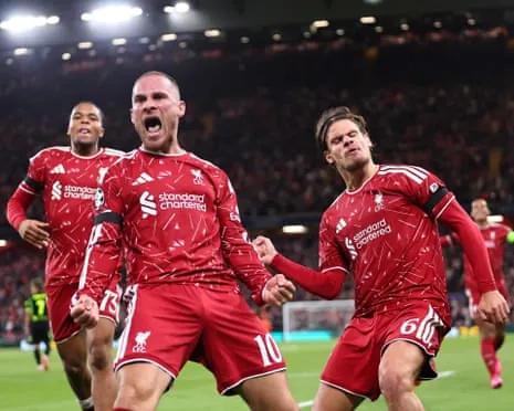Alexis Mac Allister celebrates alongside teammates Rio Ngumoha and Milos Kerkez after scoring Liverpool’s winner.